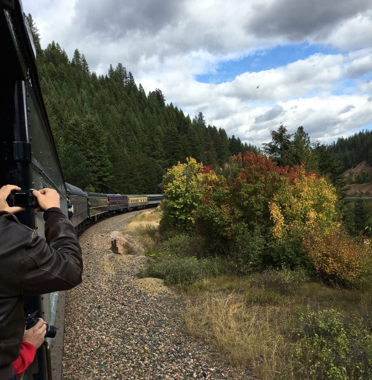 Passengers taking pictures of amazing views.