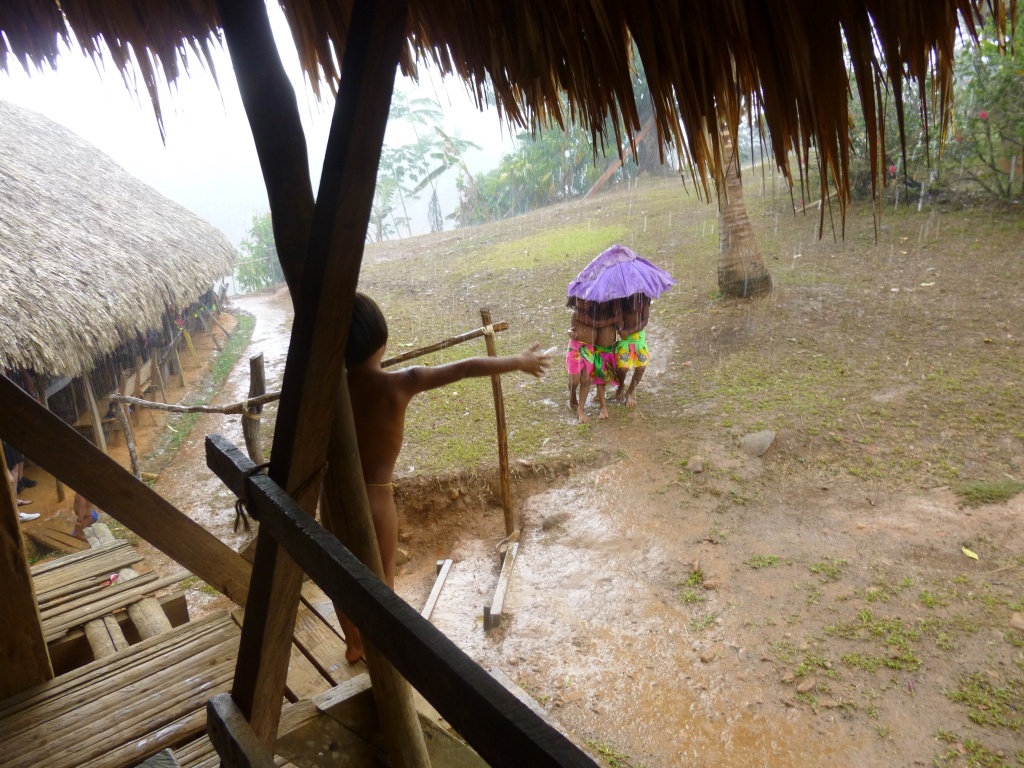 Children playing in the rain
