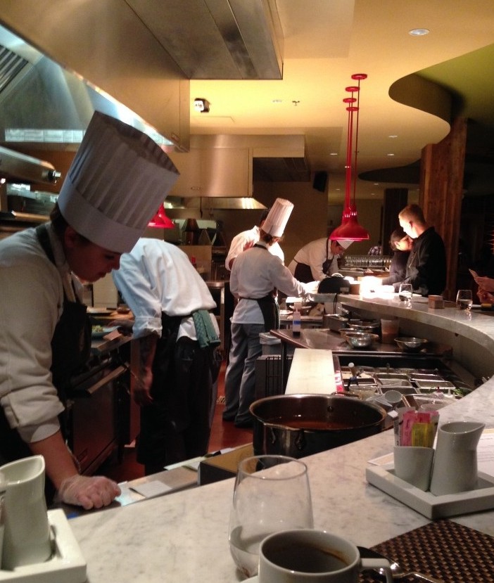 Dining while watching the students cook.