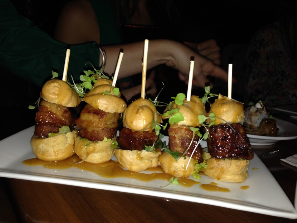 Pork belly profiteroles with salted caramel sauce